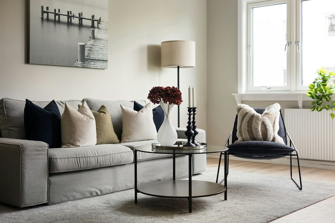 A living room filled with furniture and a large window
