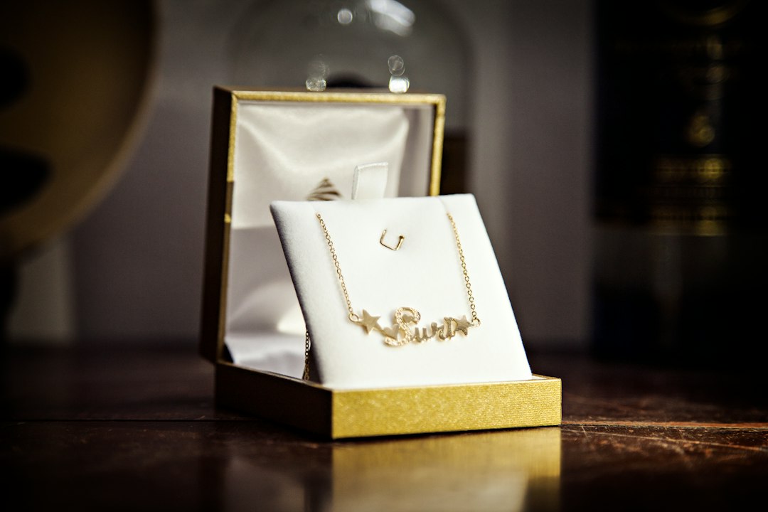 a gold box with a gold ring